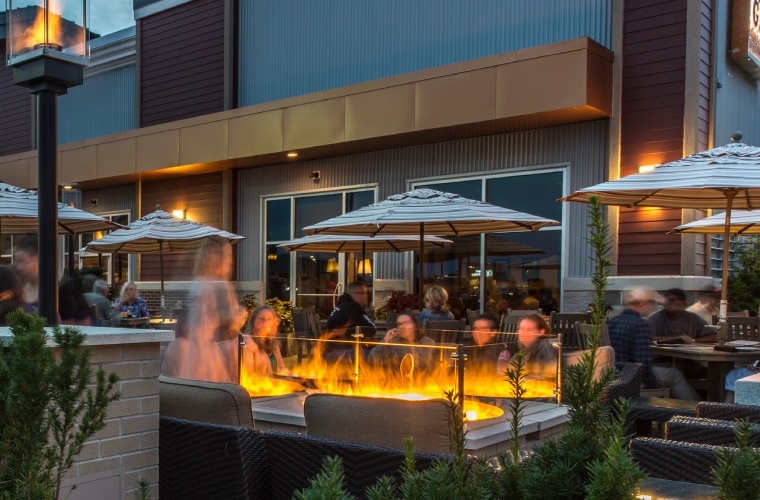 people enjoying evening at shops at highland commons